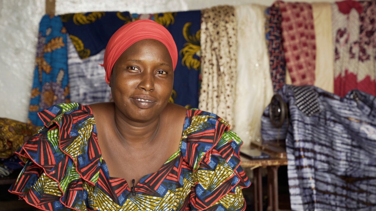 Woman named Maimouna smiling at the person behind the camera