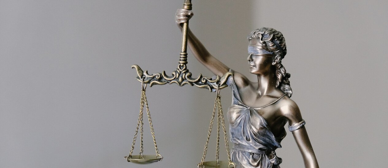 The Scales of Justice with a woman's figure